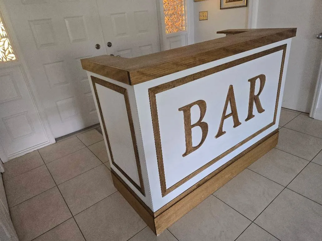 Finished white folding event bar photographed in a room